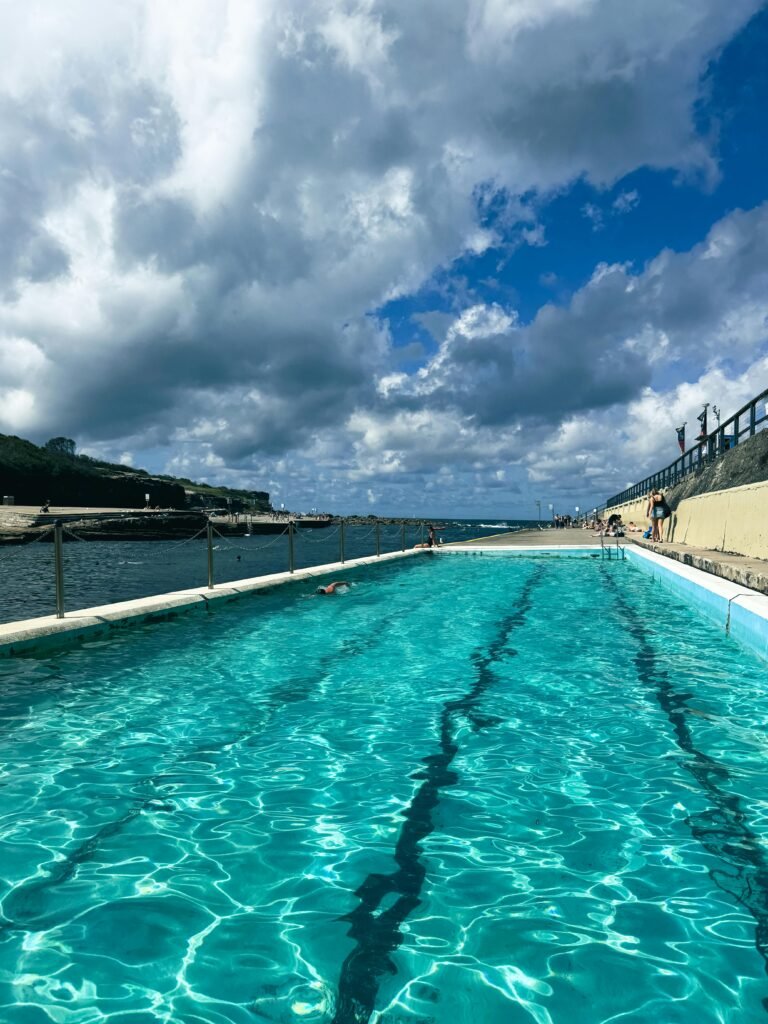 Crystal clear ocean pool at Clovelly Beach, NSW, Australia on a sunny day.